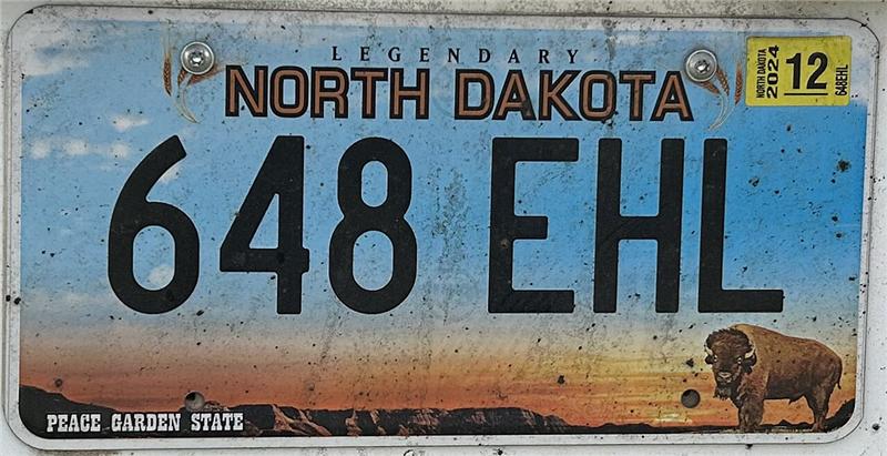 North Dakota standard Legendary license plate with 123 ABC numbering